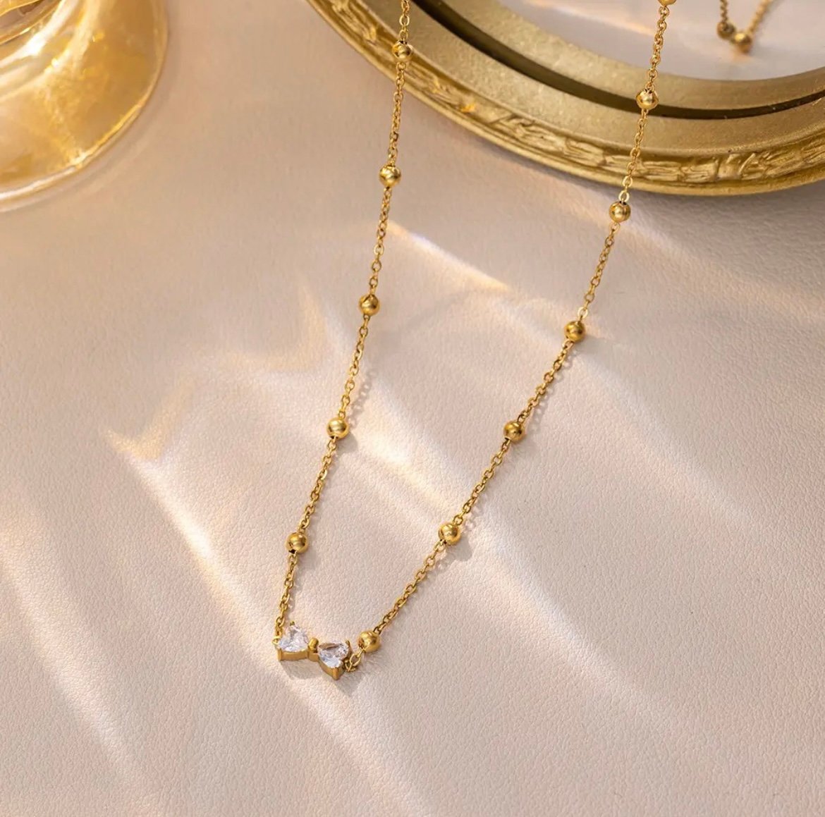 Beautiful Golden Beads Chain With Bow Design Pendant